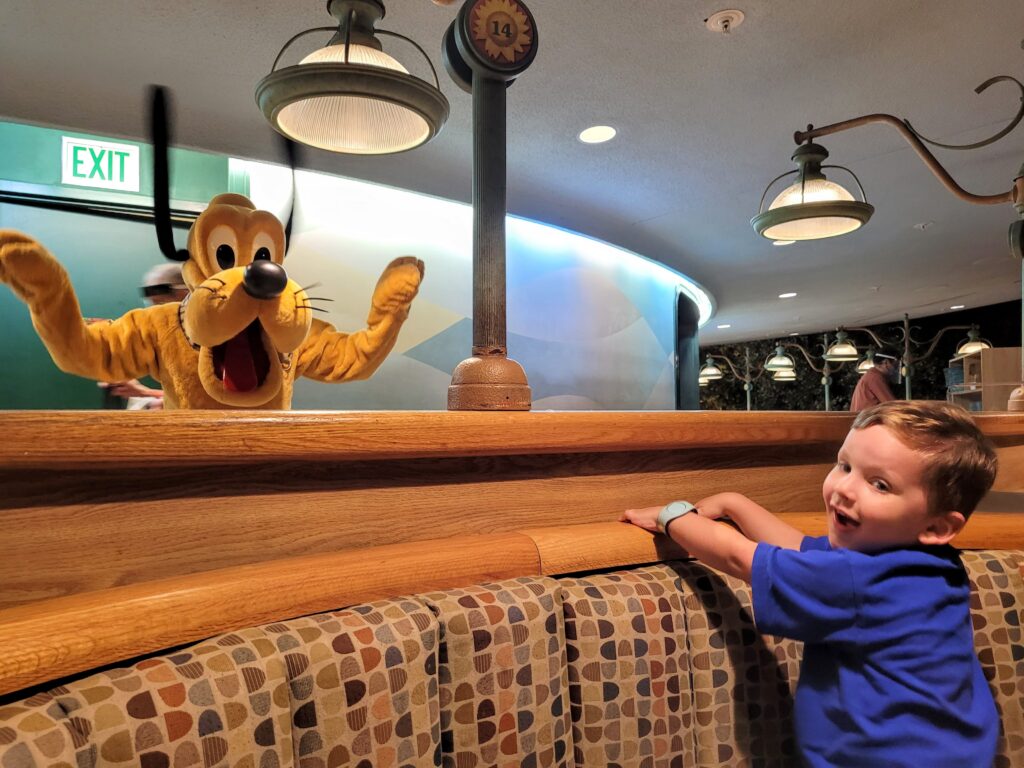 Meeting Pluto in Garden Grill at EPCOT