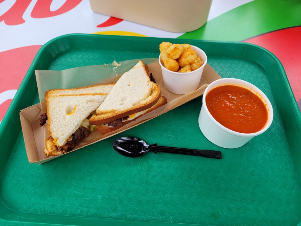 BBQ Brisket Sandwich, Potato Barrels, Tomato Soup from Woody's Lunchbox