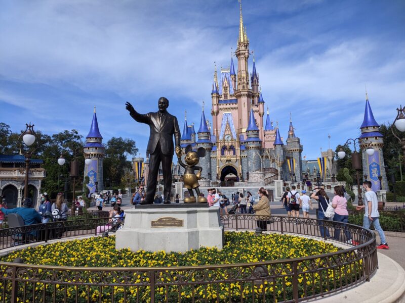 walt and mickey in front of Cinderella's castle