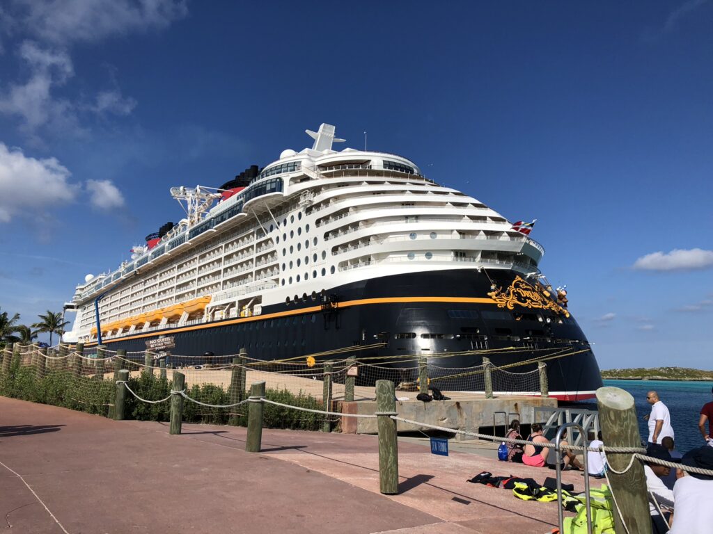 Disney Cruise docked at port.