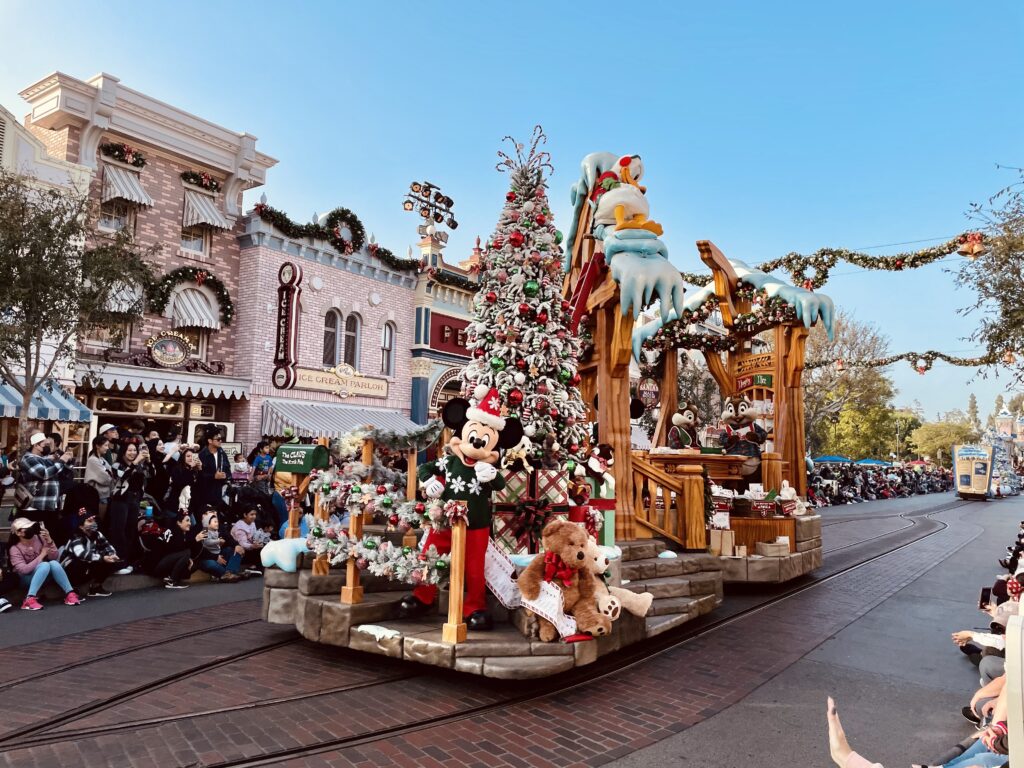 Mickey Mouse waving to guests on Main Street, U.S.A