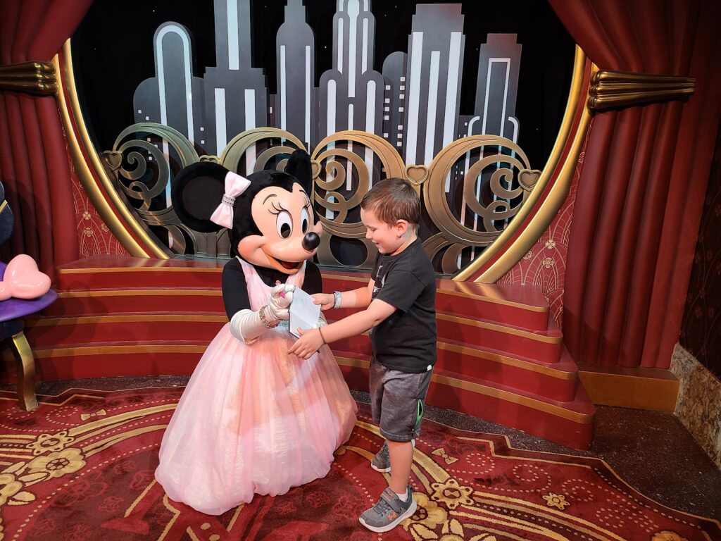 Minnie Mouse Signing Autographs During a Character Meet and Greet at Disney's Hollywood Studios