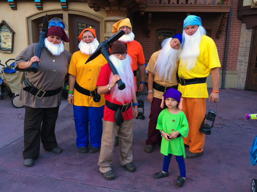 Family dressed as 7 Dwarfs at Disney World for Halloween Party