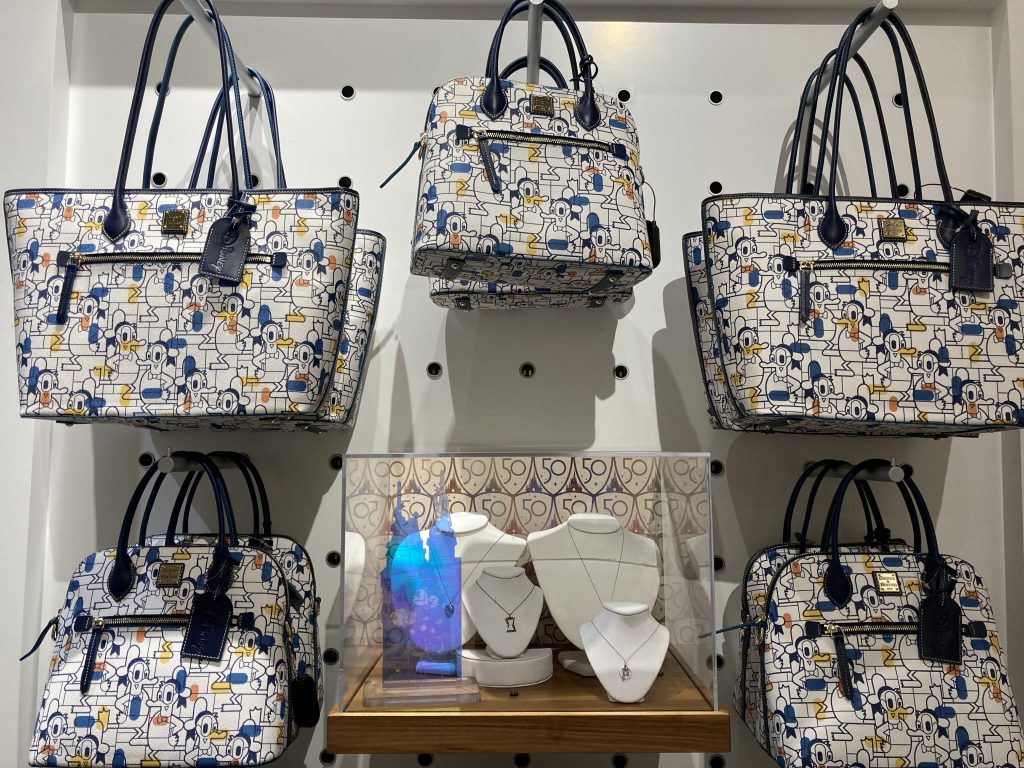 Main Street Electrical Parade Dooney & Bourke Collection Now at Uptown  Jewelers 