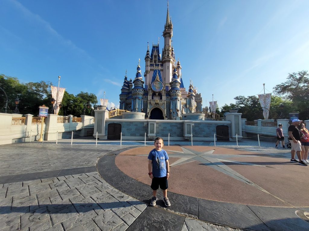 Lincoln in front of an almost empty Cinderella Castle