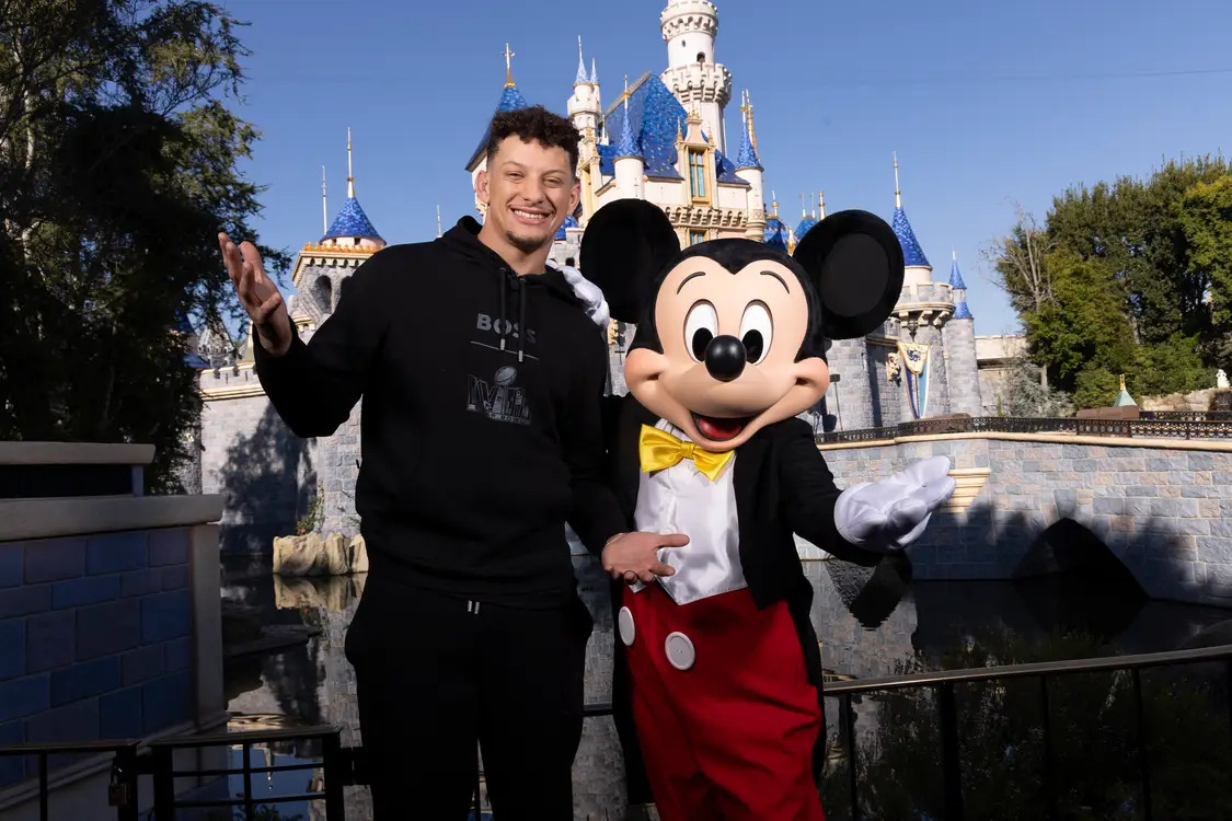 Patrick Mahomes of the Kansas City Chiefs poses with Mickey Mouse