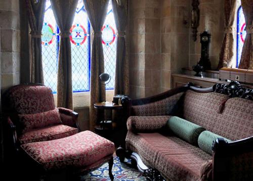 Cinderella Castle Suite study with sofa bed and armchair